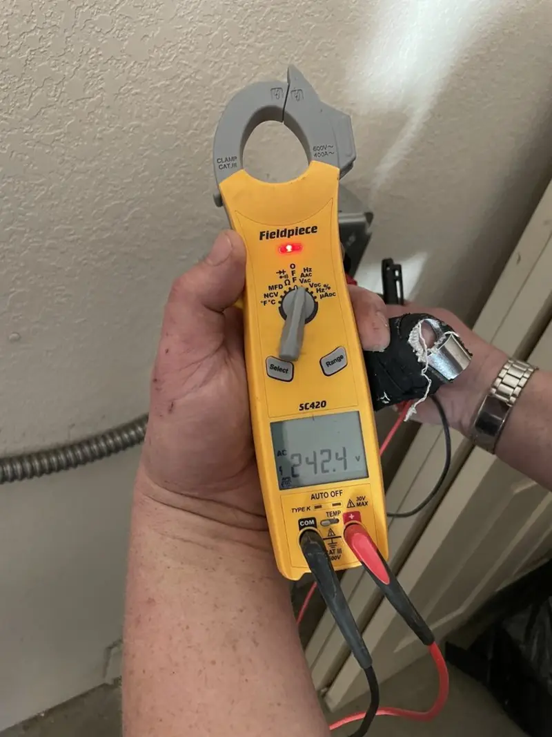Voltage testing with clamp meter during Outlet Installation in Weston Lakes